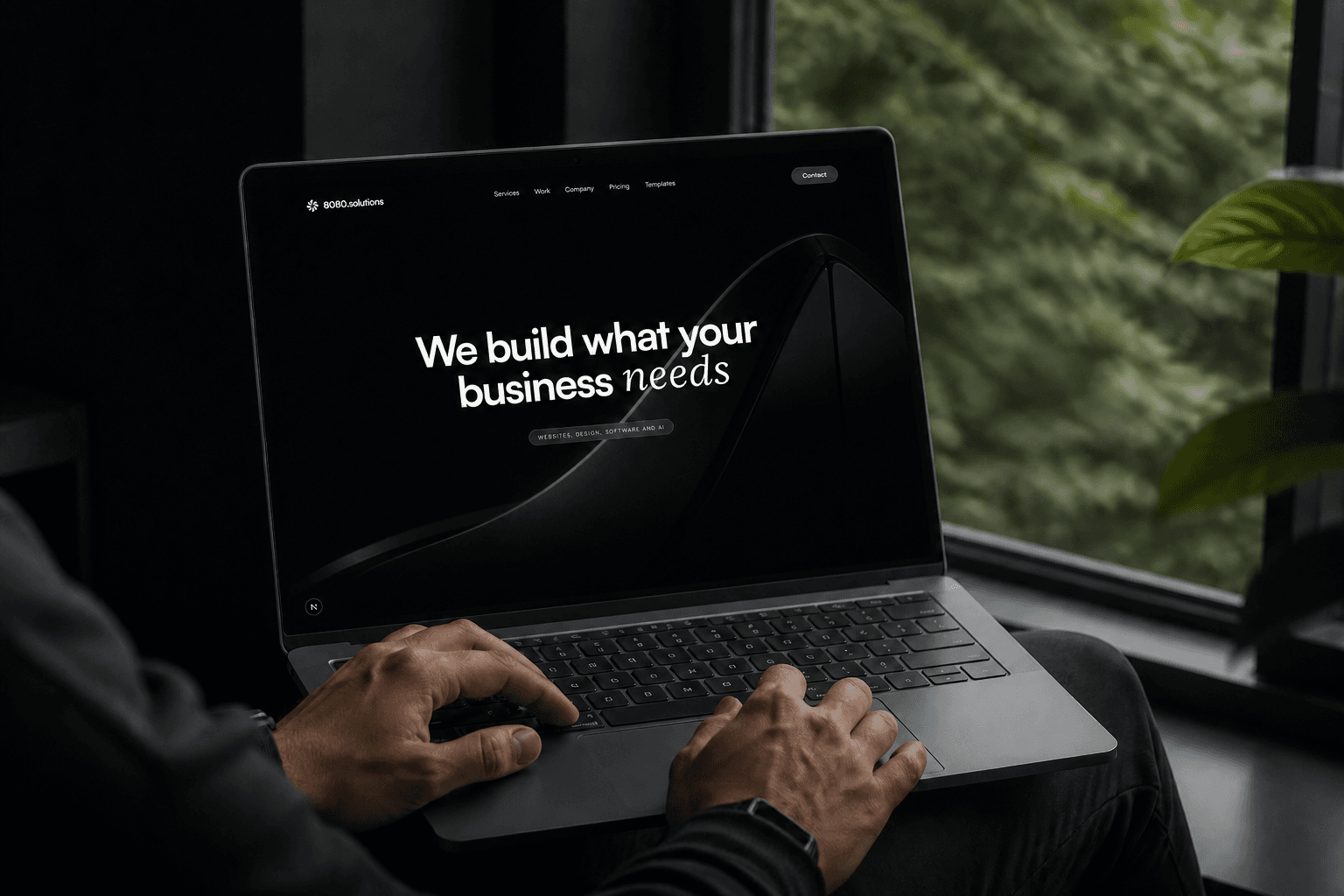 8080.solutions displayed on a laptop beside a window